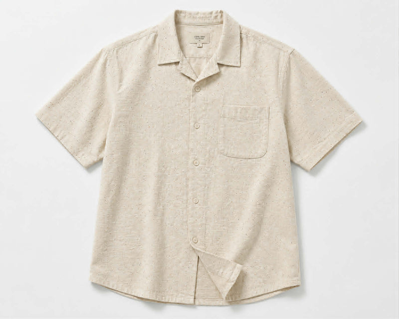 Front vew of men's loose fit short sleeve summer shirt in beige with button-up closure.