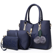  Blue 3-piece women’s handbag set with embossed rose floral design and matching wallet
