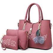 Pink 3-piece women’s handbag set with tote bag, shoulder bag, and wallet featuring embossed rose design