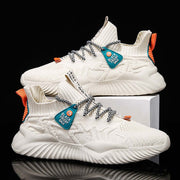 Men’s Lightweight Breathable Sneakers in white with orange accents and unique lacing design on a display box.