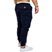 A man wearing slim fir cargo joggers for men, viewed from the back, showcasing the design and fit.