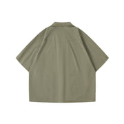 Back view of army green oversized Japanese workwear short sleeve shirt