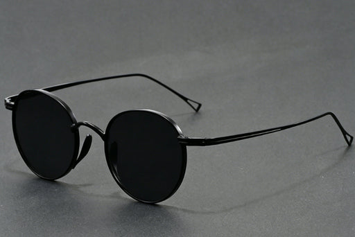 Vintage matte black round sunglasses with gray UV400 lenses