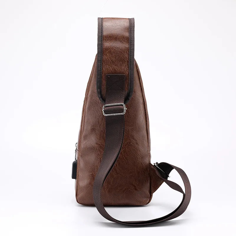 Back view profile of a men’s brown leather sling bag showing the adjustable strap and slim ergonomic shape.