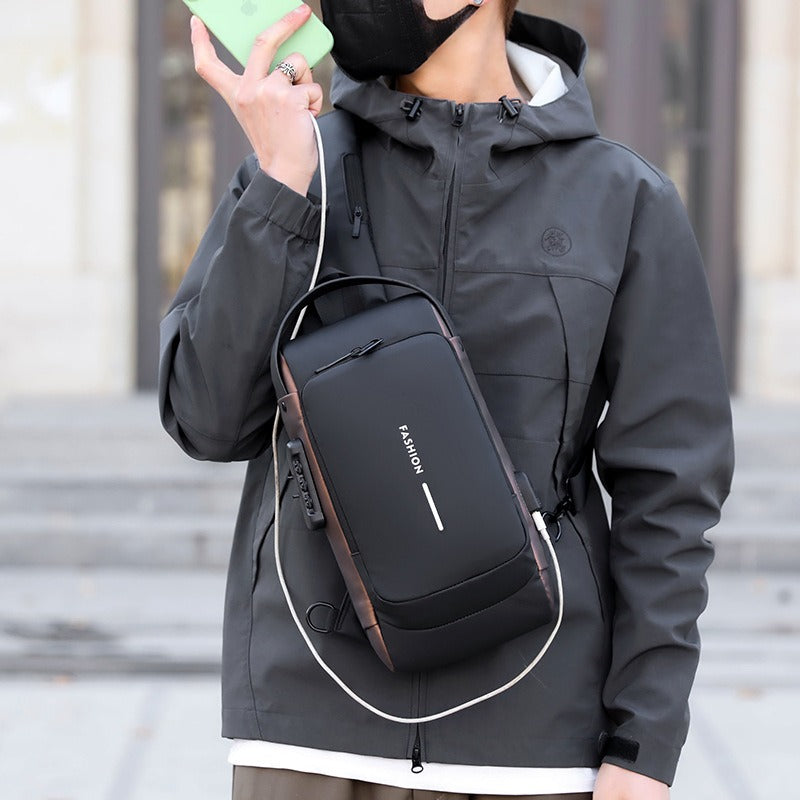 Men’s waterproof anti-theft sling bag with USB charging port, handheld close-up view.