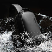 Stylized shot of the BANGE Waterproof Tech Sling Bag surrounded by splashing water highlighting its water-resistant material.