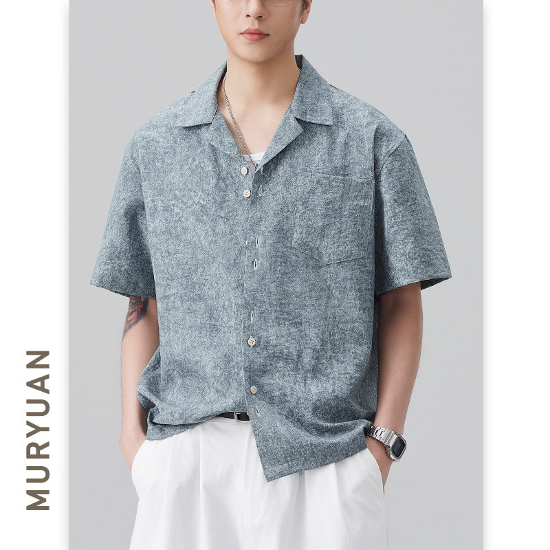 Male model wearing blue Japanese style textured Cuban collar shirt