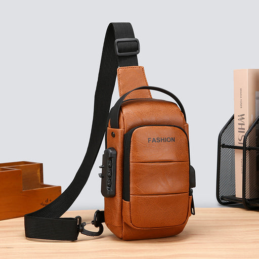 Men’s brown leather crossbody sling bag with USB charging port and front pockets.