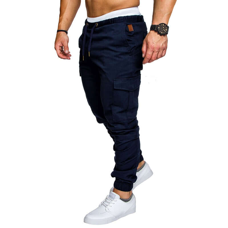slim fir cargo joggers for men in navy color, featuring adjustable drawstring and side pockets, styled with white sneakers.