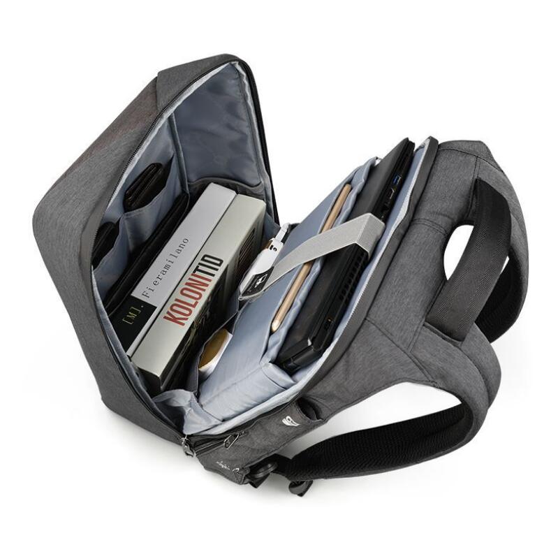 Interior of the anti-theft laptop backpack showing padded laptop sleeve, tablet compartment, and organized multi-pockets for daily essentials.