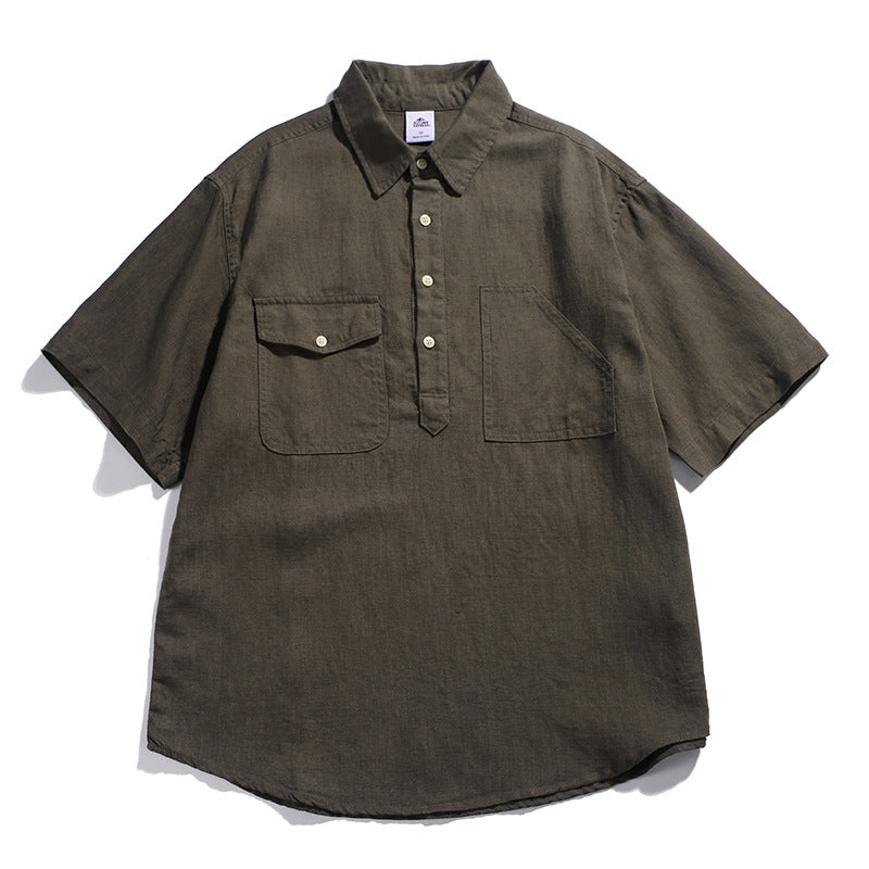 Olive green men’s loose fit workwear polo shirt with vintage utility pocket design