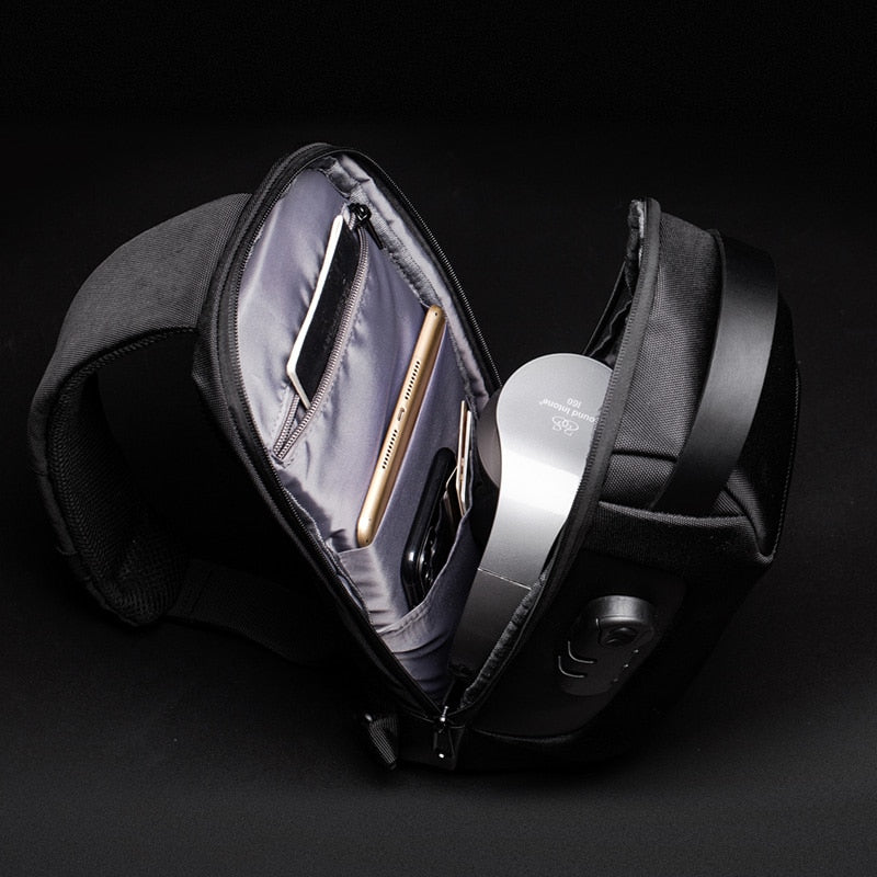 Interior view of sling bag showing multiple compartments for phone, wallet, and essentials.