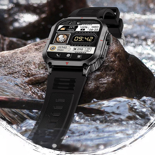 Rugged outdoor smart watch placed on rocks near water