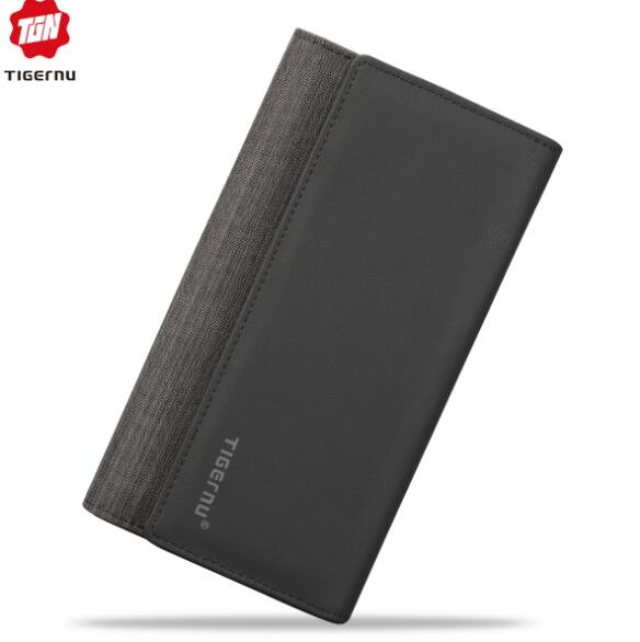 Black bifold men’s wallet with textured fabric panel and slim rectangular silhouette.
