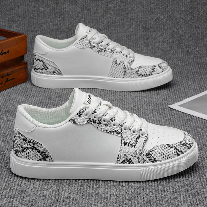 White low top men's sneakers with snake print accents and comfortabe thick sole