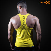 Man wearing a yellow GymX fitness tank top, showing a muscular back and racerback design against a dark background.