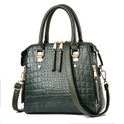 Army green crocodile embossed handbag with gold zipper details
