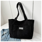 Black corduroy tote shoulder bag minimalist design

