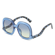Blue leopard oversized oval sunglasses with blue yellow gradient lenses designed for trendy summer fashion looks.
