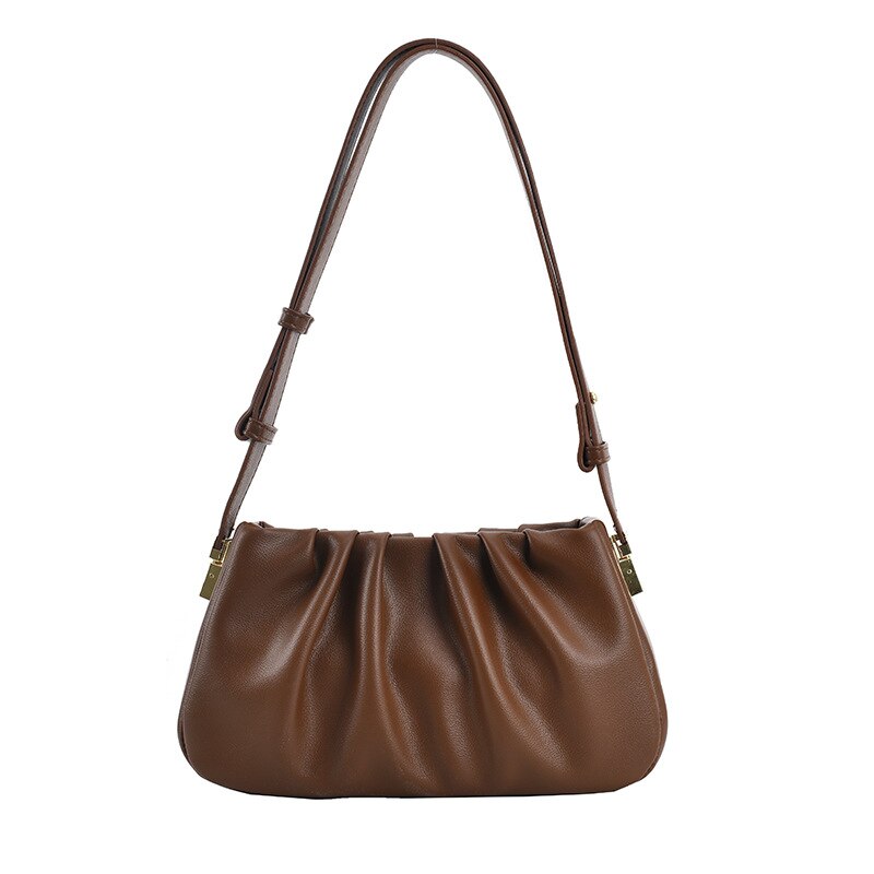 Auburn brown cloud soft shoulder bag featuring a soft pleated silhouette, adjustable strap, and minimalist modern design.
