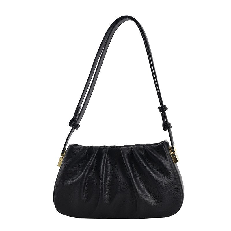 Black cloud soft shoulder bag with pleated design, adjustable shoulder strap, and gold-tone hardware for everyday elegance.
