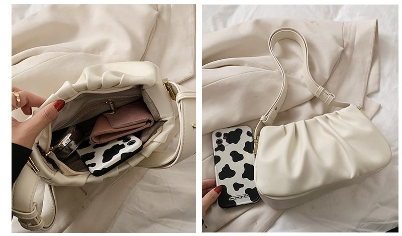 White cloud soft shoulder bag displaying spacious interior storage capacity with room for a phone, wallet, cosmetics, and daily essentials.
