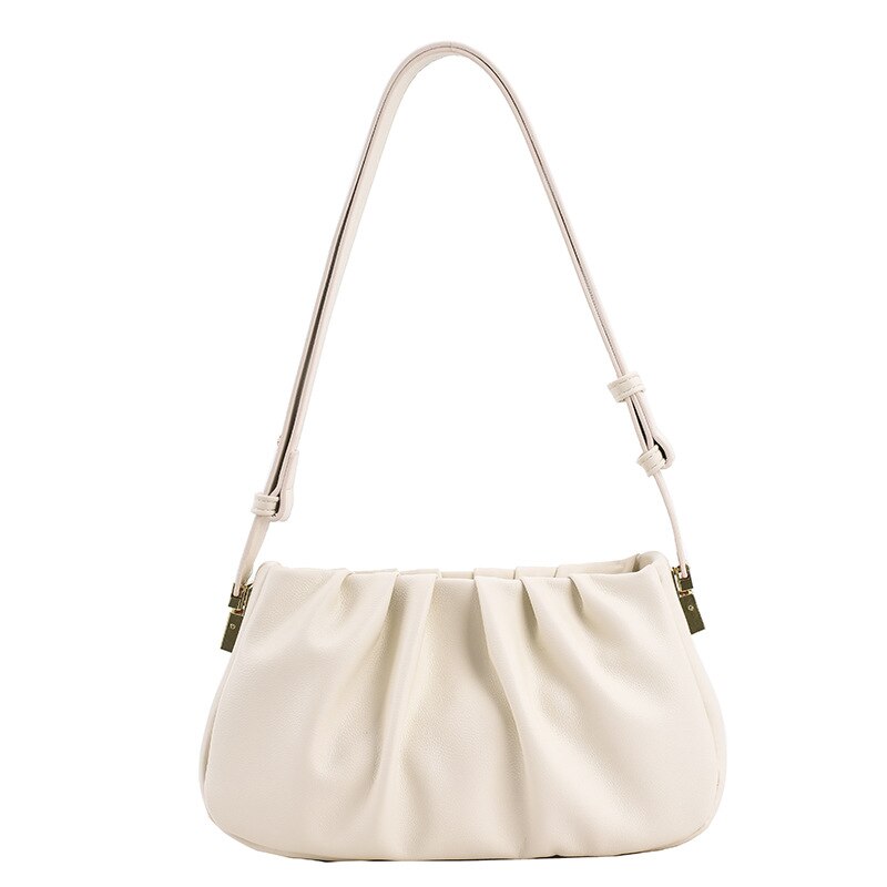 White cloud soft shoulder bag with a soft gathered design, adjustable shoulder strap, and chic minimalist styling.
