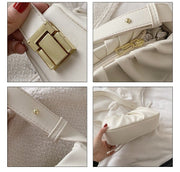 Close-up details of a white cloud soft shoulder bag showing gold-tone hardware, zipper closure, adjustable strap, and premium craftsmanship.
