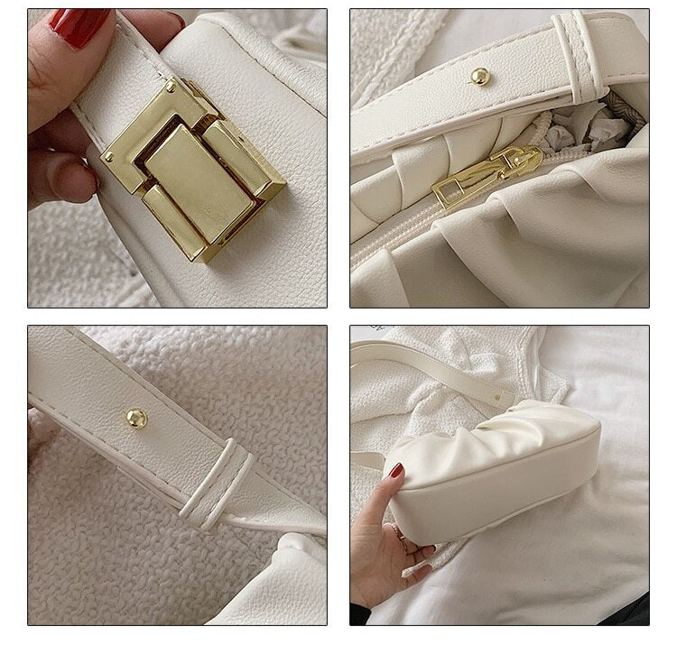 Close-up details of a white cloud soft shoulder bag showing gold-tone hardware, zipper closure, adjustable strap, and premium craftsmanship.
