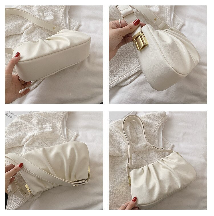 Multiple angle views of a white cloud soft shoulder bag featuring a structured base, pleated design, and adjustable shoulder strap.
