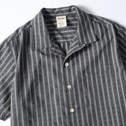 Close-up detail of striped Cuban collar button-up shirt