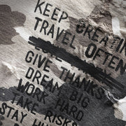 Close-up texture of distressed tactical camouflage shirt fabric