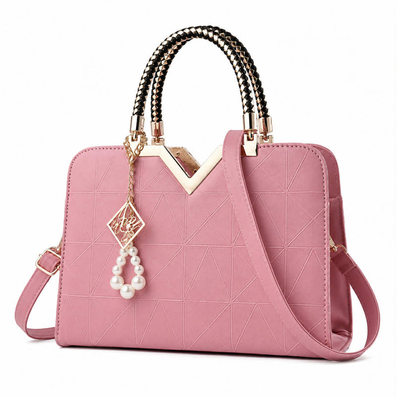 Elegant pink women's handbag with geometric pattern and gold handle detail
