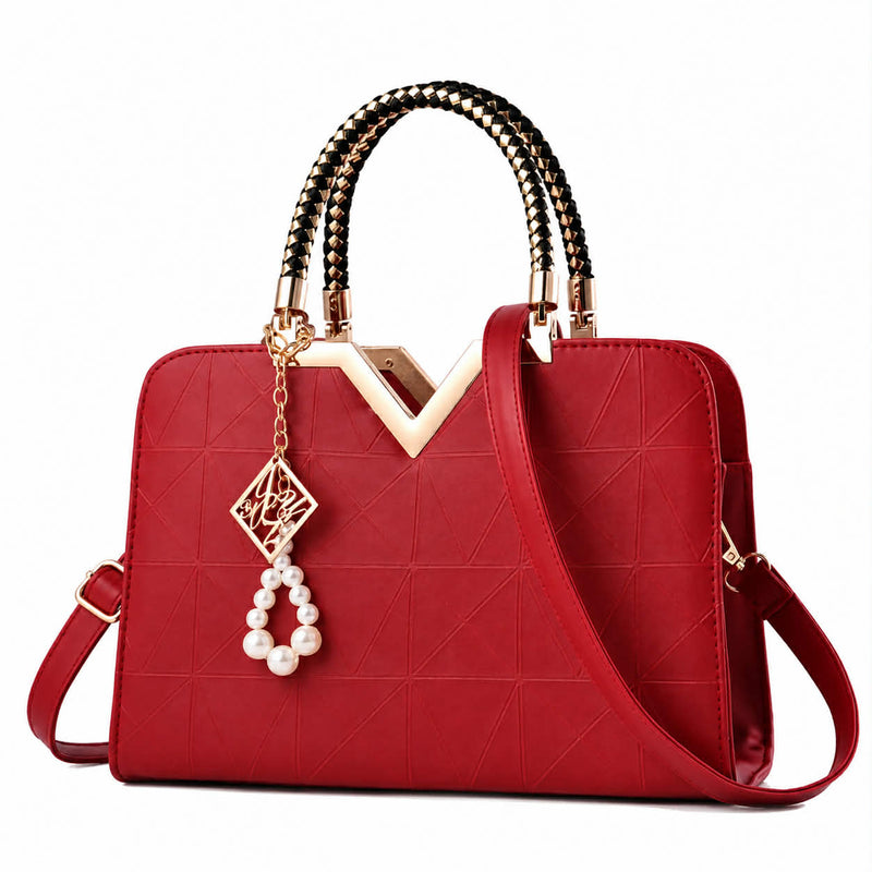 Elegant wine red women's handbag with geometric pattern and shoulder strap
