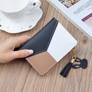 Black geometric women's wallet with card holder, coin pocket, and tassel pendant.
