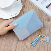 Blue geometric women's PU leather wallet with tassel charm and compact design.
