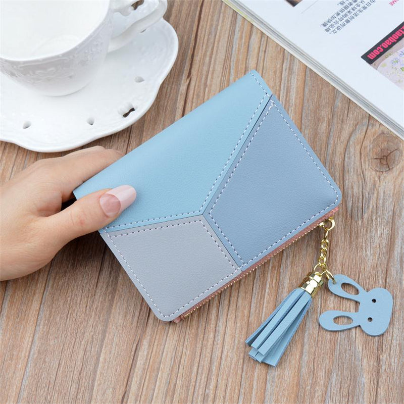 Blue geometric women's PU leather wallet with tassel charm and compact design.
