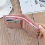 Women's geometric wallet with multiple card slots, cash compartment, and secure snap closure.
