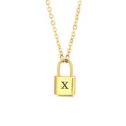 Gld initial lock necklace with letter X pendant on a minimal clean background