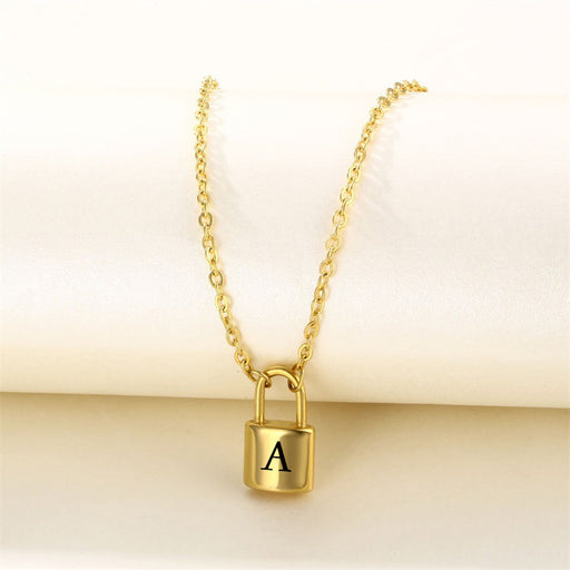 Gold initial lock necklace with letter A pendant on a clean neutral background