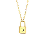Gold initial lock necklace with letter B pendant on a minimal clean background 