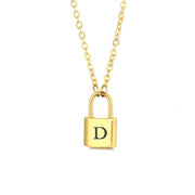 Gold initial lock necklace with letter D pendant on a minimal clean background 