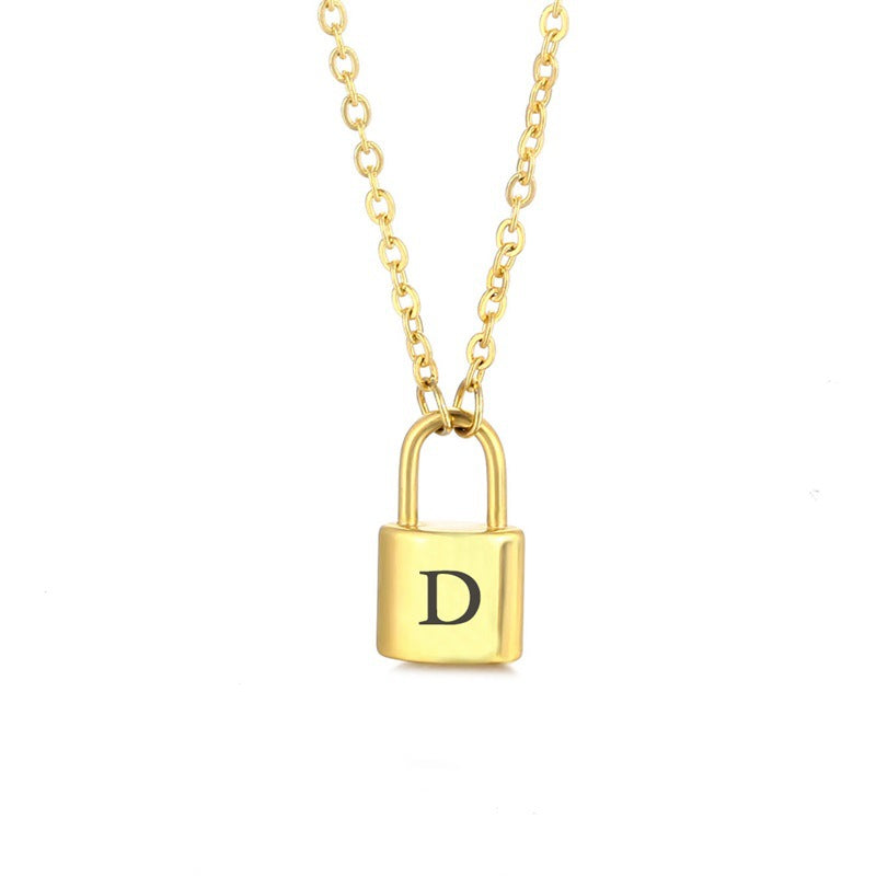 Gold initial lock necklace with letter D pendant on a minimal clean background 