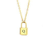 Gold initial lock necklace with letter Q pendant on a minimal clean background 