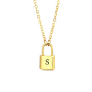 Gold initial lock necklace with letter S pendant on a minimal clean background 