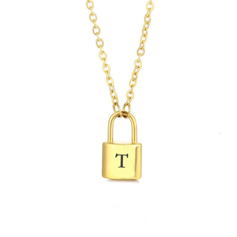 Gold initial lock necklace with letter T pendant on a minimal clean background 