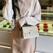 Elegant white crossbody handbag styled with casual outfit for everyday use
