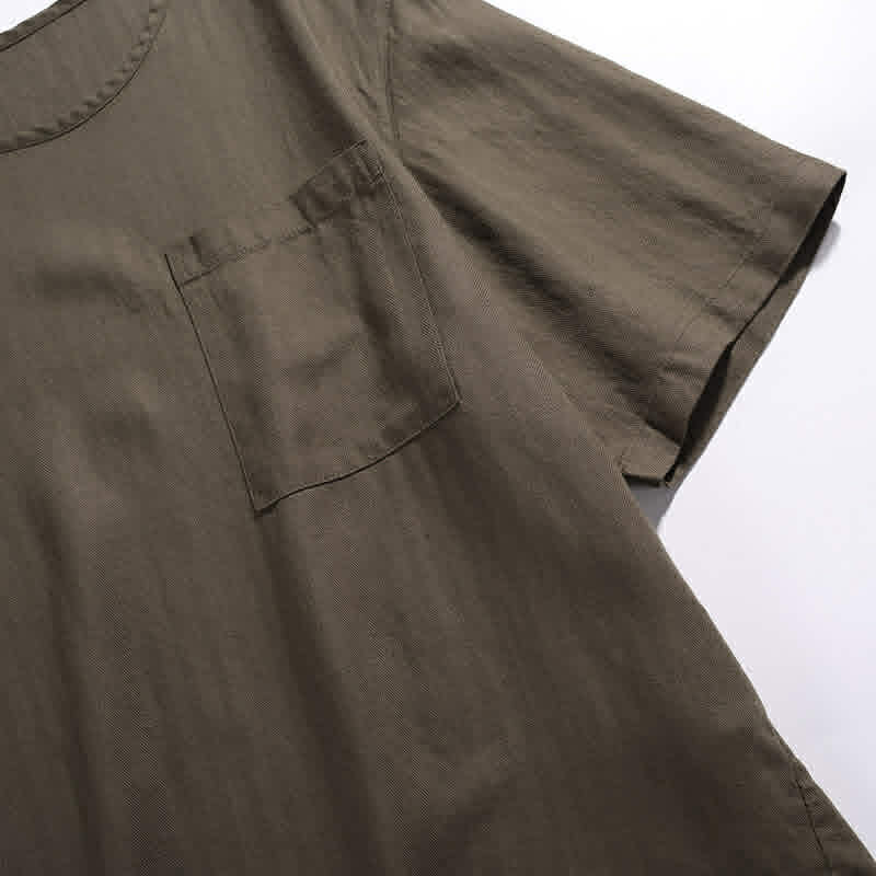 Chest pocket detail on men's relaxed fit cotton pocket t-shirt showing clean stitching and minimalist design
