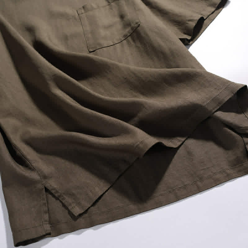 Close-up fabric texture of men's cotton pocket t-shirt showing lightweight breathable material
