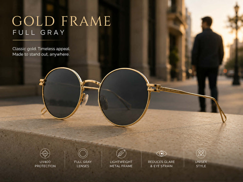 Classic round sunglasses with gold metal frame and full gray lenses styled for everyday fashion wear.
